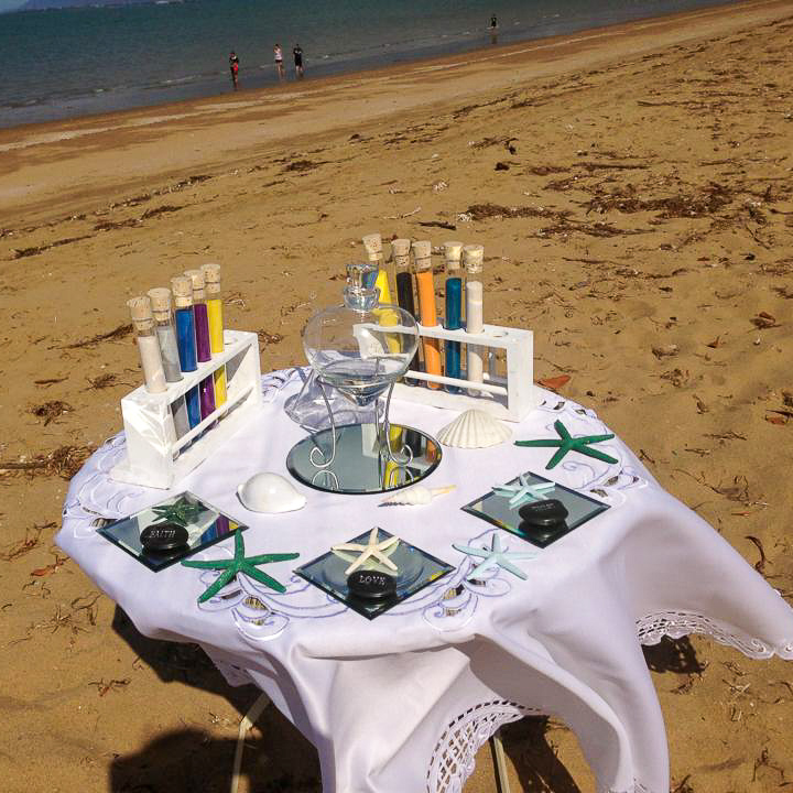 Sand unity ceremony table at a wedding on the Strand in Townsville City, QLD